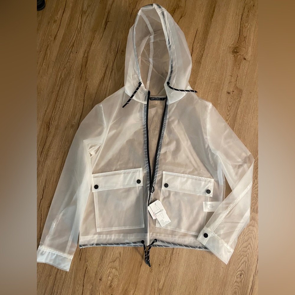 Transparent raincoat new with tag.